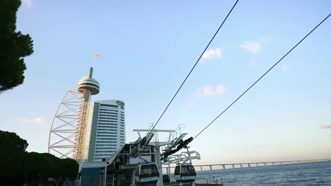 Cable car from Vasco da Gama Tower to Lisbon Oceanarium. shore of Tagus river.   Stock Footage 224528908