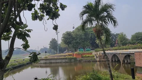 Cable car, view from below near the lake at Taman Mini Video stock 314584184