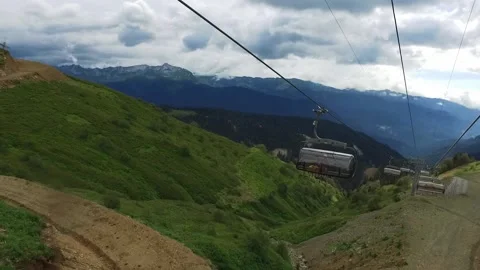 Cable car. View from the ski lift in the mountains to the green gorge. Beautiful Stock Footage 161769730