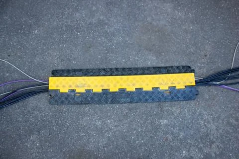 Cable channel, plastic floor, wiring box, plastic on asphalt Foto stock