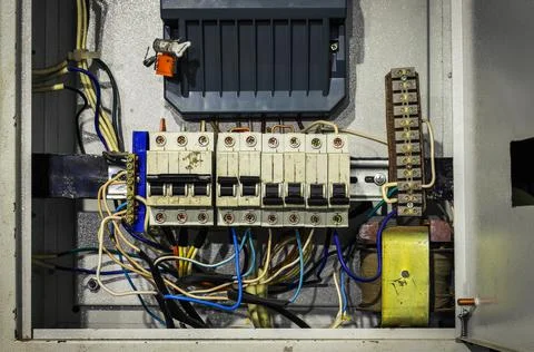 Cable chaos in electric control panel close-up. Tangled wires Stock Photos