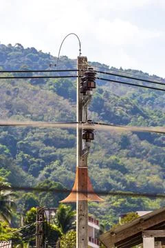 Cable clutter on a power pole in town city Thailand. Foto stock