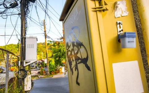 Cable clutter on a power pole in town city Thailand. Stock Photos