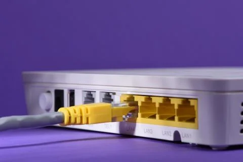 Cable connected to internet router Stock Photos