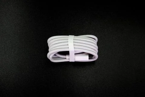 Cable connector micro-USB to USB on black background. Stock Photos