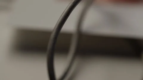 A cable of a device filmed with a narrow depth of field Stock Footage 271545335