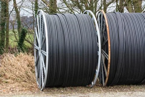 Cable drums with fiber optic cable Steel roller with fiber optic cables fo... Stock Photos