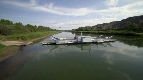Cable Ferry Crosses Red deer River Stock Footage 172250924
