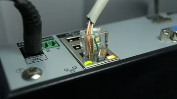 Cable Internet connection and the flashing orange button Stock Footage 85603979