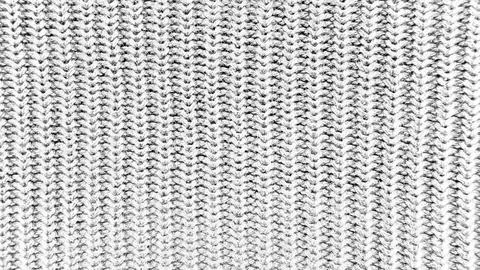 Cable knit texture closeup in grayscale with undulating braided stitches ev.. Stock Photos