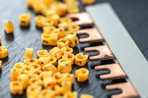 Cable markers scattered on the table, macro shot. 写真素材