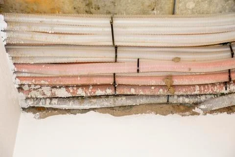 Cable mess in new building - network, electricity, ventilation Stock Photos