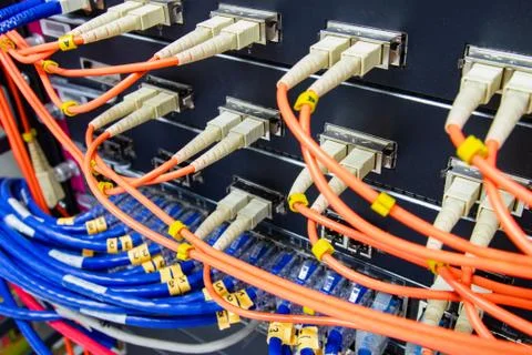Cable network , fiber optic cable connect to switch port in server room Photos