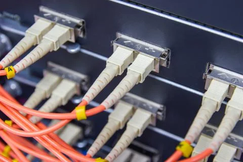 Cable network , fiber optic cable connect to switch port in server room Stock Photos