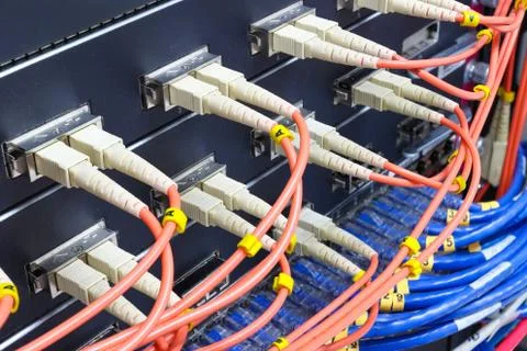 Cable network, fiber optic cable connect to switch port in server room 스톡 사진