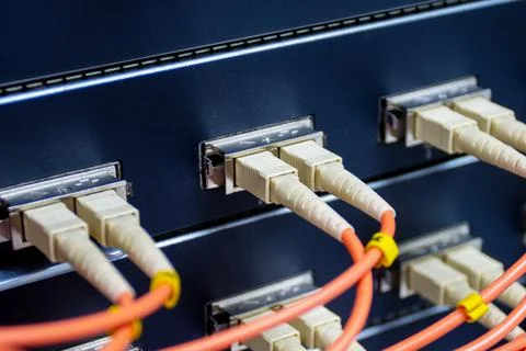 Cable network, fiber optic cable connect to switch port in server room Photos