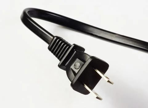 Cable with a plug of the power supply of US devices. Stock Photos