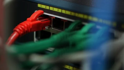 A cable plugged into a network connector Vídeos de archivo 94379975