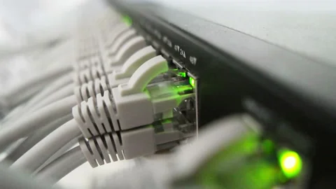 Cable is plugged into a working server equipment Stock Footage 98994119