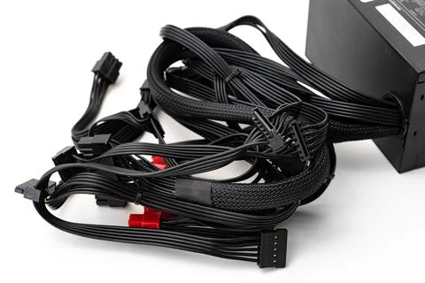 Cable of PSU. The computer's power supply is on a white background. Stock Photos