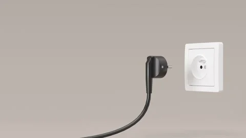 Cable is pulled out of white electric socket. Close up view. Save electricity Stock Footage 217374021