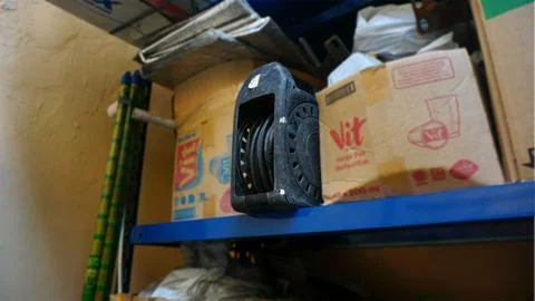 Cable roll in the blue warehouse rack Stock Photos