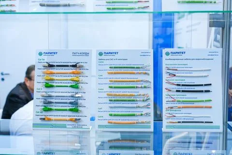 Cable samples displayed at industrial trade show. Professional technician Stock Photos