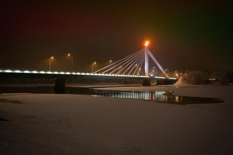 Cable-stayed bridge across the ice-covered Kemijoki River Stock Photos
