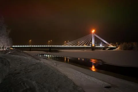 Cable-stayed bridge across the ice-covered Kemijoki River Stock Photos