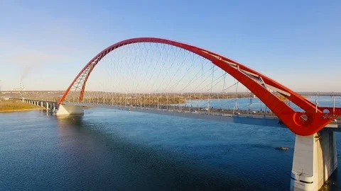 Cable-stayed bridge with a big red arch in Novosibirsk. Aerial shooting 4K. Video stock 81385532