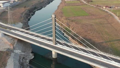 Cable-stayed bridge (harp design) with a single pylon (tower) over Moraca river Stock Footage 232898301