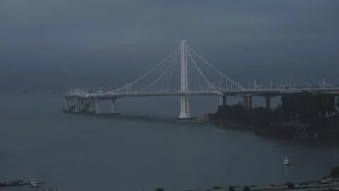 Cable-Stayed Bridge Over Bay Under Dark Overcast Sky Dusk Stockbeeldmateriaal 344911707