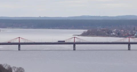 Cable-stayed bridge over the Daugava River on a calm overcast day. Stock Footage 320169868