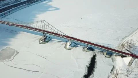 Cable-stayed bridge over the river in winter Stock Footage 146920442