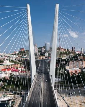 Cable-stayed bridge over the Sea of Japan on the background of the city seap,foo Stock Photos