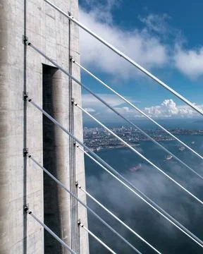 Cable-stayed bridge over the Sea of Japan on the background of the city seap,foo Stock Photos