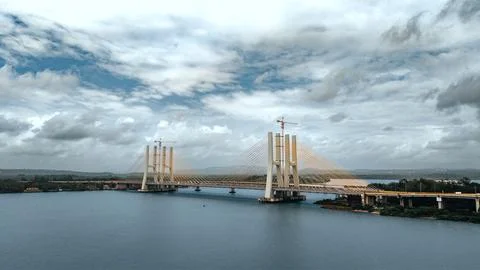 Cable Stayed Bridge Over A Wide River In Goa Under A Cloudy Sky Stock Photos