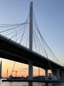 Cable-Stayed Bridge Tower at Sunset with Modern Skyline Stock Photos