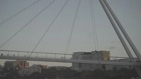 Cable Stayed Pedestrian Bridge Silhouetted at Dusk Stock Footage 345050546