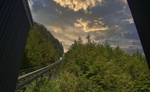 A cable train to the top of the mountain at sunset Stock Photos