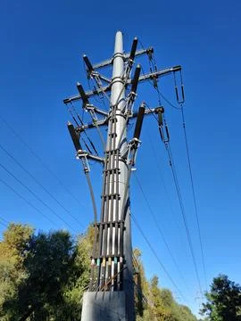 Cable transition pole. Transition structure overhead to underground 库存照片