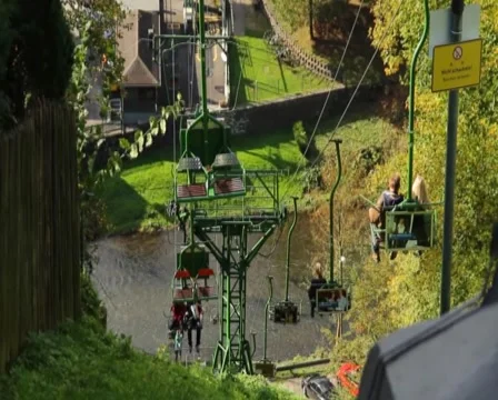 Cable way over river, people tourists ascending descending cabin, click for HD Stock Footage 43910433