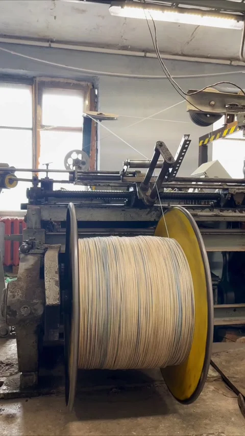 Cable winding machine at work. Industrial equipment producing wire. Stock Footage 322002868