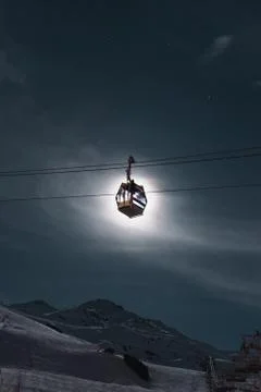A cablecar covering the moon at a ski resort Stock Photos