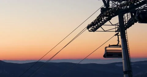 Cablecar working in the evening on a high mountain at sunset. Stock Footage 170417487