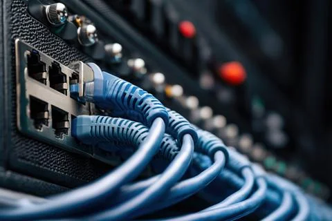 Cables connect devices in dark Fotos Stock