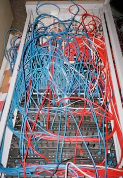 Cables connected to computer network server Stock Photos