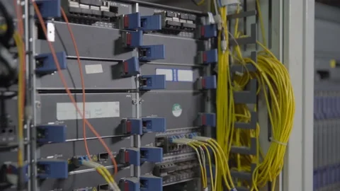 Cables connected to switch in server room in data centr india Stock Footage 220177102