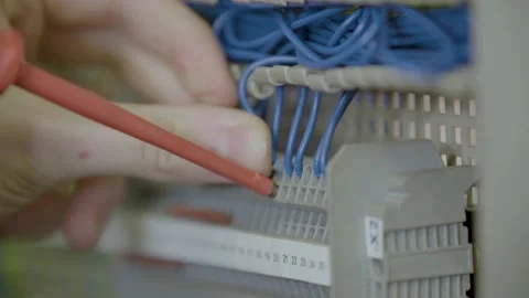 Cables get fitted into electronic board 스톡 동영상 141529384