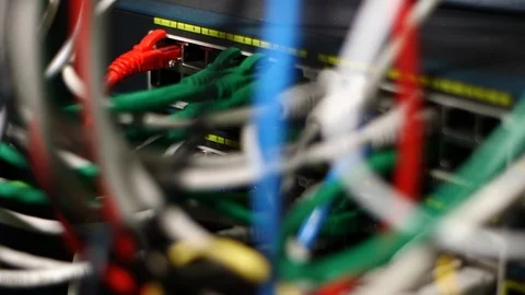 Cables plugged into a network connector Stock Footage 94379890